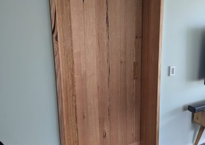Custom wooden door frame by Dead-Level Outdoor Constructions for outdoor spaces.